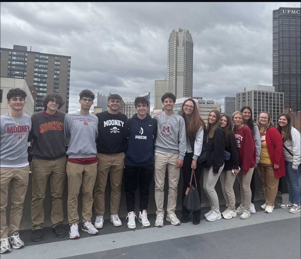 Picture of students with former Cardinal Mooney student that now attend’s The University of Duquesne </p>
<p>